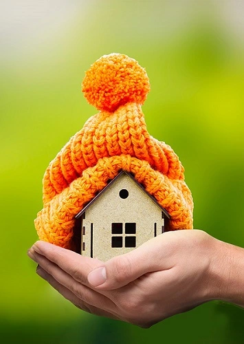 Oranage Hat On Wooden House